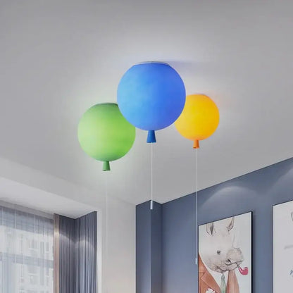 Vibrant glossy balloon pendant light in blue green and yellow with ceiling installation method for childrens bedroom