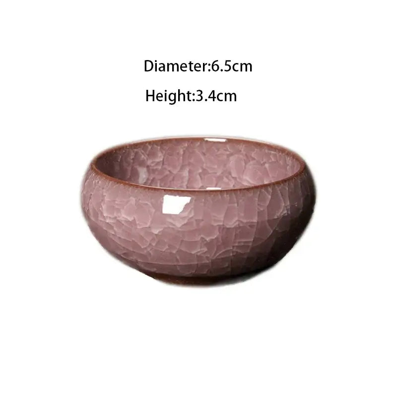 A delicate pink ceramic tea cup with a crackled glaze and smooth rim for decorbites ice cracking ceramic set