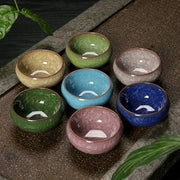 Set of seven vibrant ice cracking ceramic tea cups in green blue and pink hues perfect for dining room decorbites decor