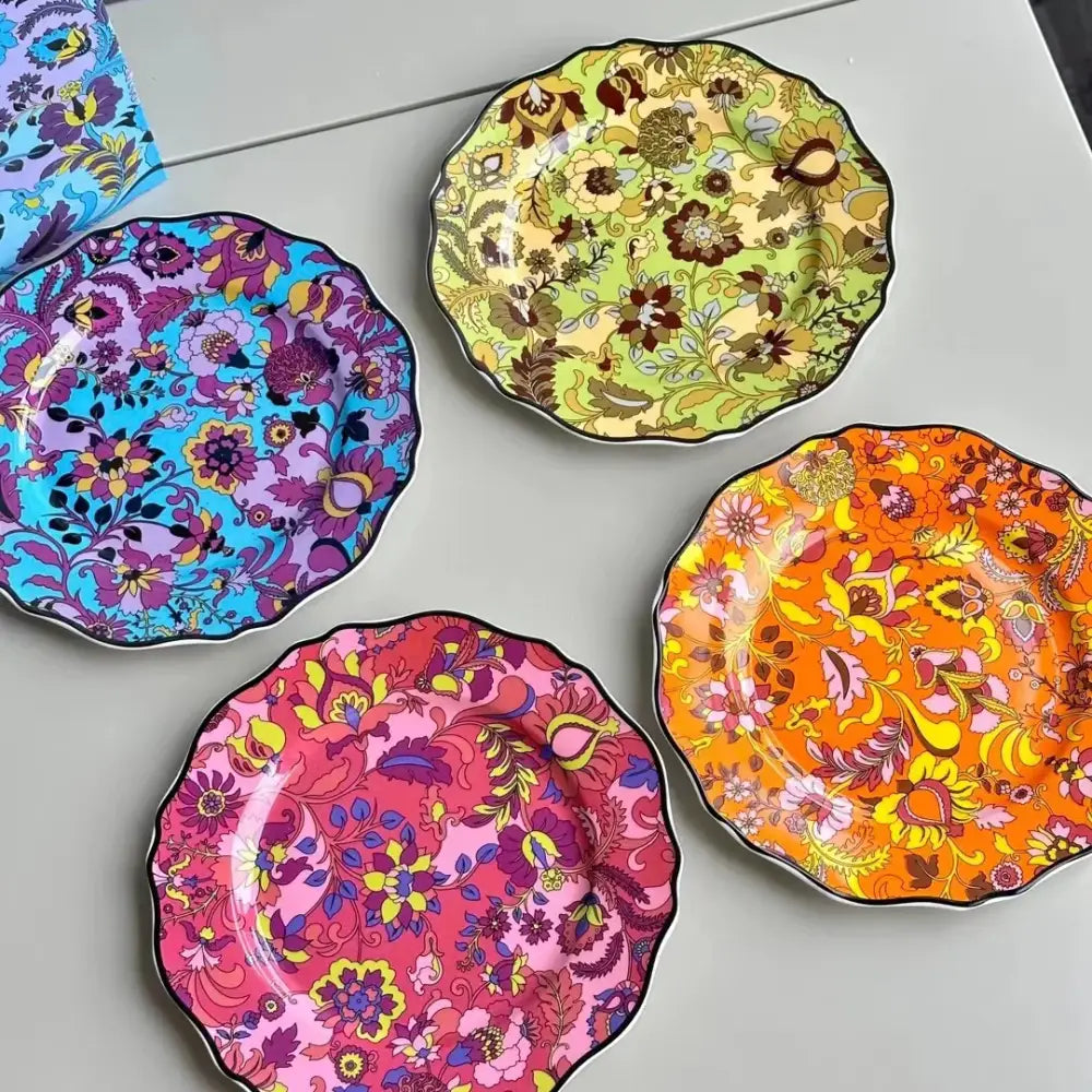 Vibrant jungle flower bone dining plates set with scalloped edges and bold floral patterns in assorted colors