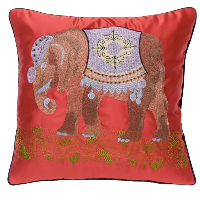 Vibrant red satin pillow cover with intricate brown elephant embroidery and purple gold decorative blanket for decorbites elephant embroidery pillow