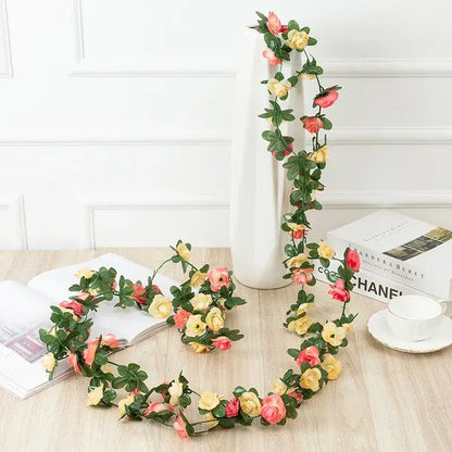 Delicate artificial rose flowers vine garland with soft pink and yellow roses and lush green leaves for living room decor