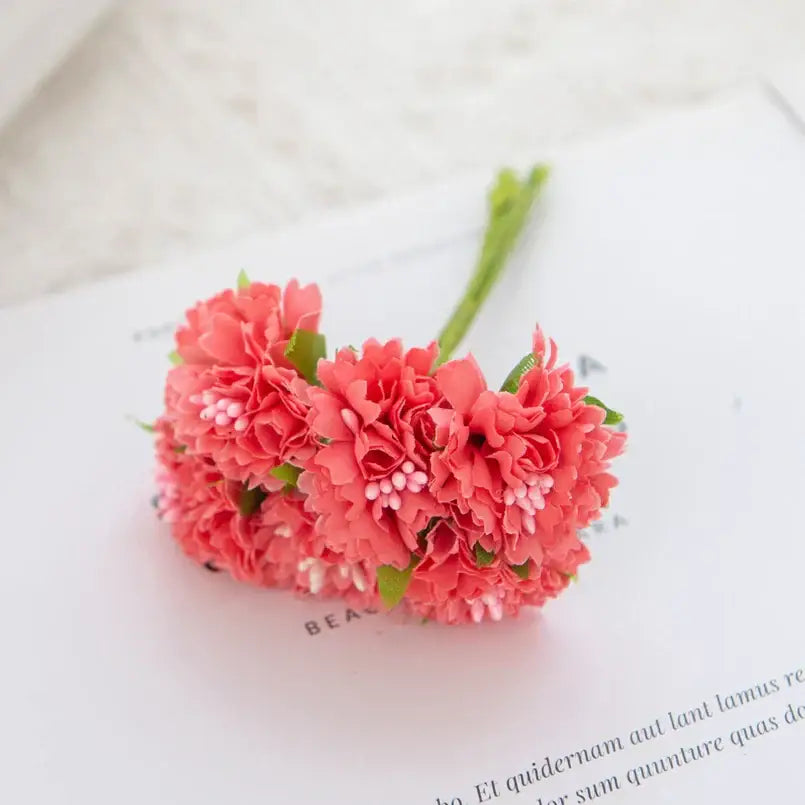 A cluster of coral-pink silk flowers with delicate ruffled carnation stamen for decorbites carnation stamen decor