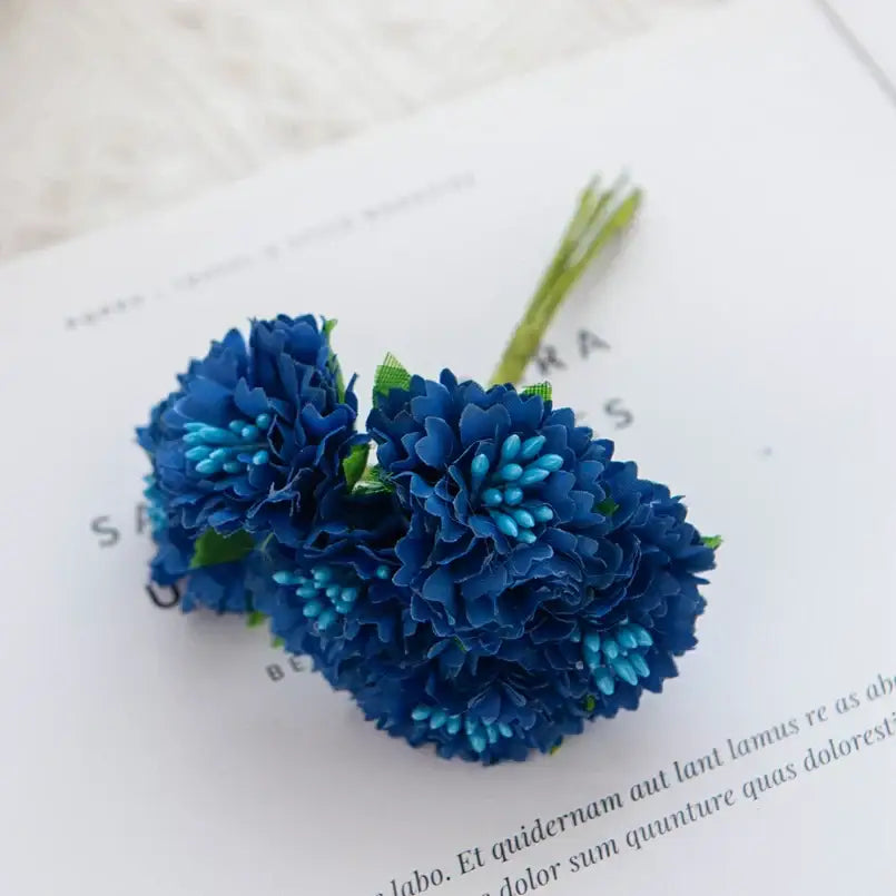 A cluster of artificial blue carnation stamen silk flowers with layered petals and green stems for decorbites living room decor