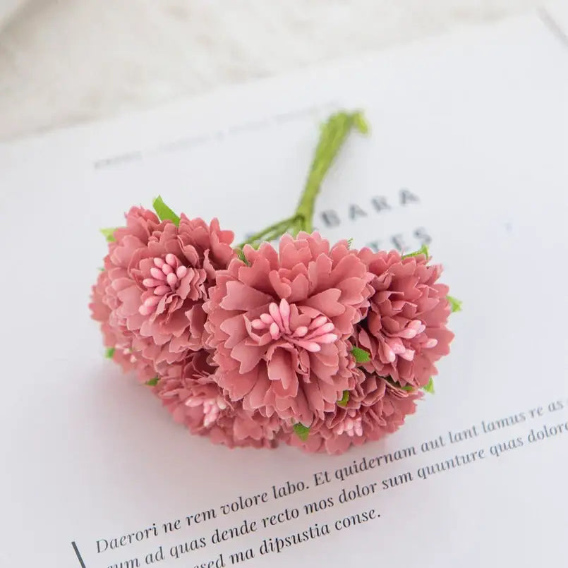 A cluster of soft pink silk flowers with carnation stamen and green stems for decorbites carnation stamen decor