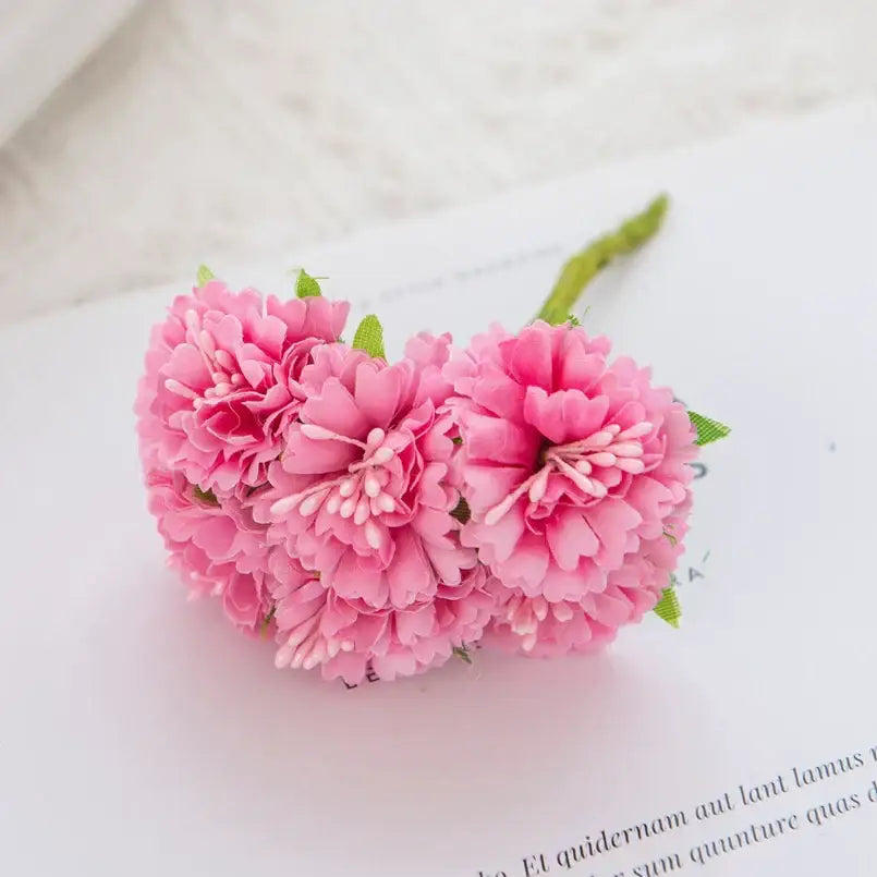 A cluster of delicate pink carnation stamen silk flowers with green stems and leaves for decorbites living room decor