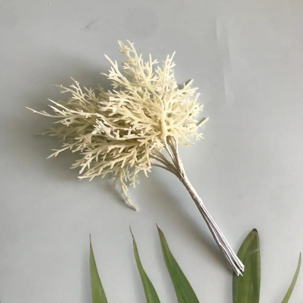 Delicate off-white artificial coral dried flower bouquet with branching fronds in a vibrant multicolored dried flower bouquet display in white vase