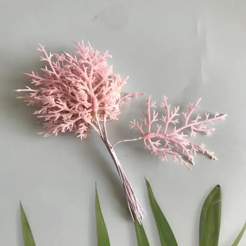 Pink artificial coral dried flower bouquet with delicate branches in white vase for living room decor