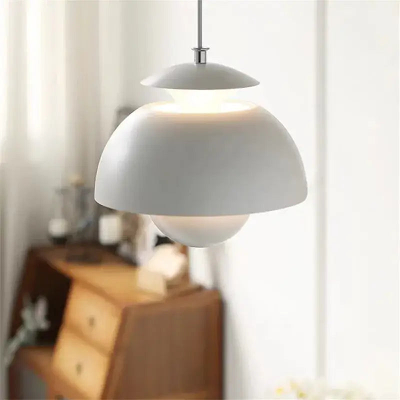 A modern white pendant light with sleek layered dome and metallic rod in decorbites designer flower bud collection
