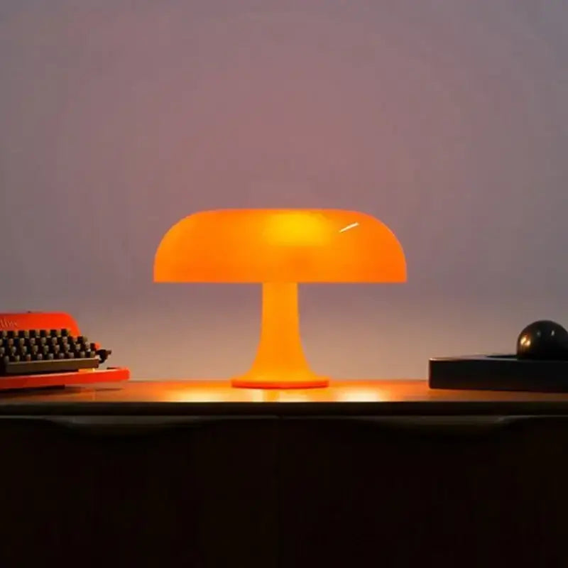 Vibrant orange mushroom night light with smooth translucent plastic body ideal as bedhead night light or light mushroom desk lamp