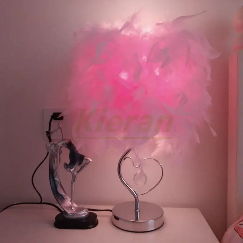 Vibrant pink crystal feather led table lamp with heart-shaped metallic base and crystal accent for bedroom decorbites crystal feather