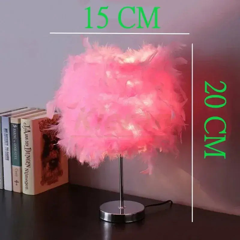 Vibrant pink crystal feather led table lamp with slender metallic stand and circular base for bedroom decorbites crystal feather