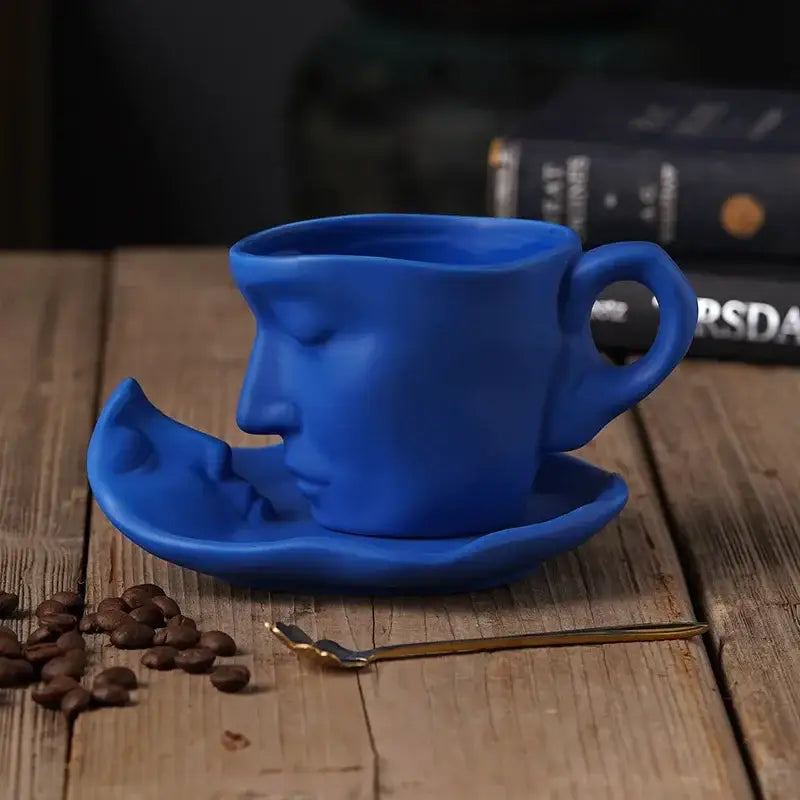 A vibrant blue ceramic frosted ceramic face mug set featuring a serene human face for kitchen and dining decorbites