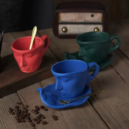 Vibrant red frosted ceramic face mug with closed eyes and integrated handle from decorbites mug set for kitchen use