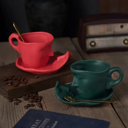 Vibrant red and teal frosted ceramic face mug set with gold spoons from decorbites for kitchen and dining room decor