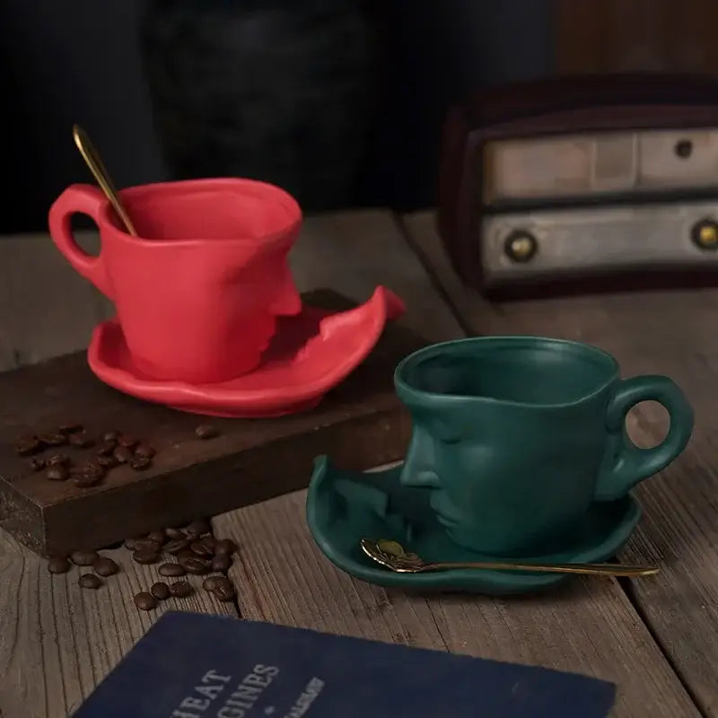 Vibrant red and teal frosted ceramic face mug set with gold spoons from decorbites for kitchen and dining room decor