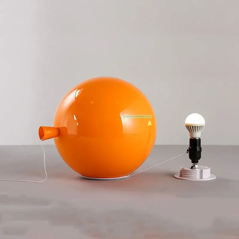 Vibrant red orange and yellow balloon lamps wall light featuring a glossy spherical orange lamp with a nozzle detail