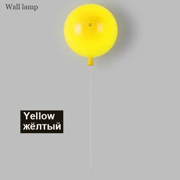 Bright yellow balloon lamps wall light with glossy finish and small orange stem for bedroom use