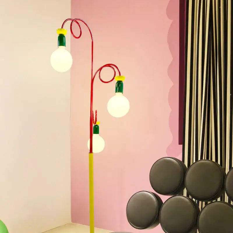 Vibrant red and yellow decorbites art led floor lamp with three glowing bulbs for stylish living room decor