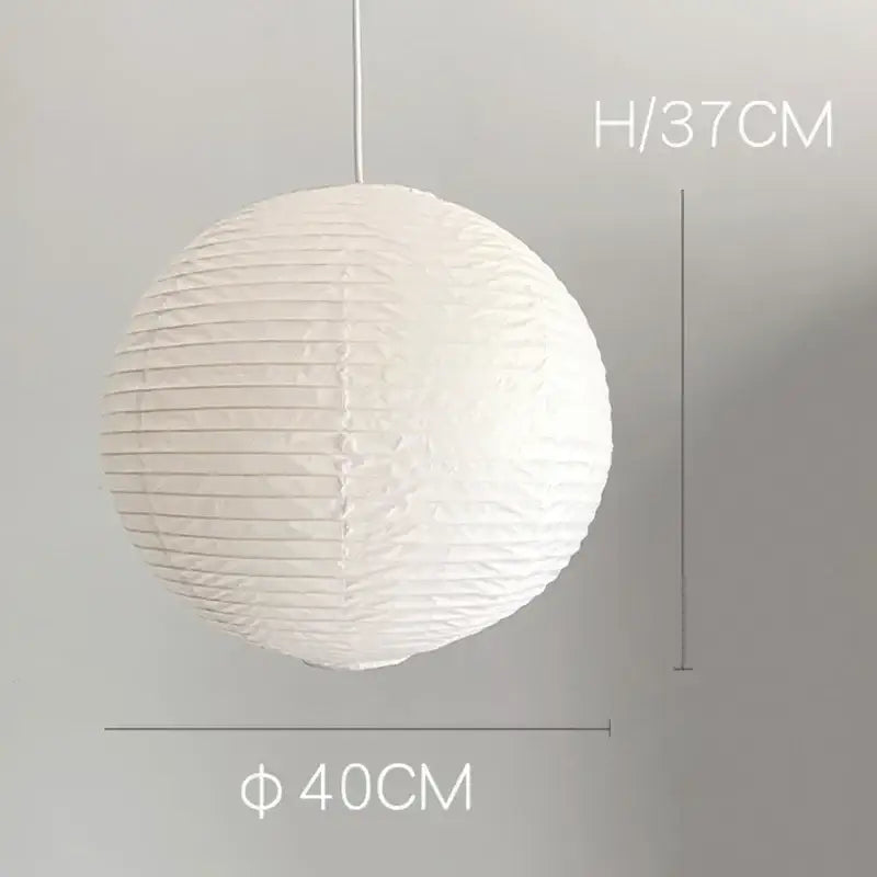 White spherical vintage akari rice paper pendant light with vertical ridges and hanging cord for bedroom or living room