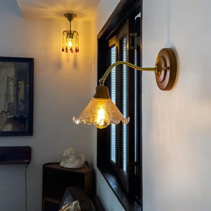 Antique brass wall lights with a textured amber cracked glass led shade for vintage bedroom decorbites cracked glass style