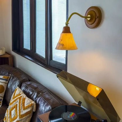 Vintage amber cracked glass led wall lights featuring a warm amber glass lamp with deer silhouette on brass fixture