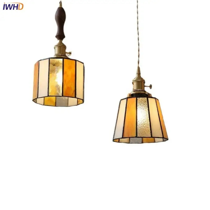 Two vintage amber and cream stained glass pendant lamps with brass frames and knob switch for dining room decorbites copper knob