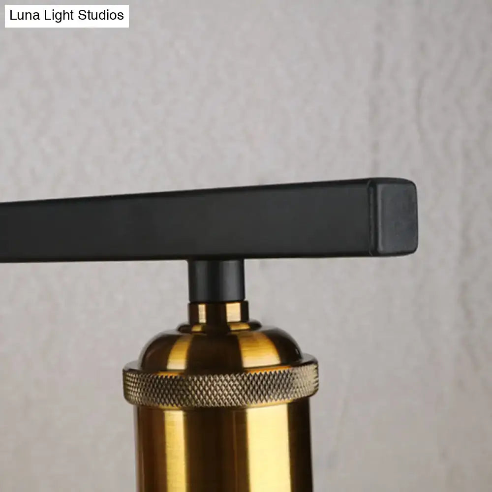 Industrial-style table lamp with black matte handle and brass base featuring knurled ring for use with 220v-240v amber glass lighting