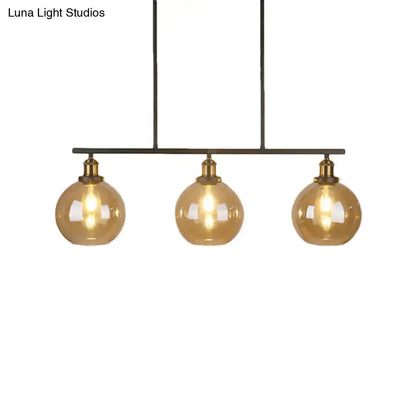 Decorbites™ vintage amber glass island pendant with three amber glass globe cones and brass accents for 220v-240v use