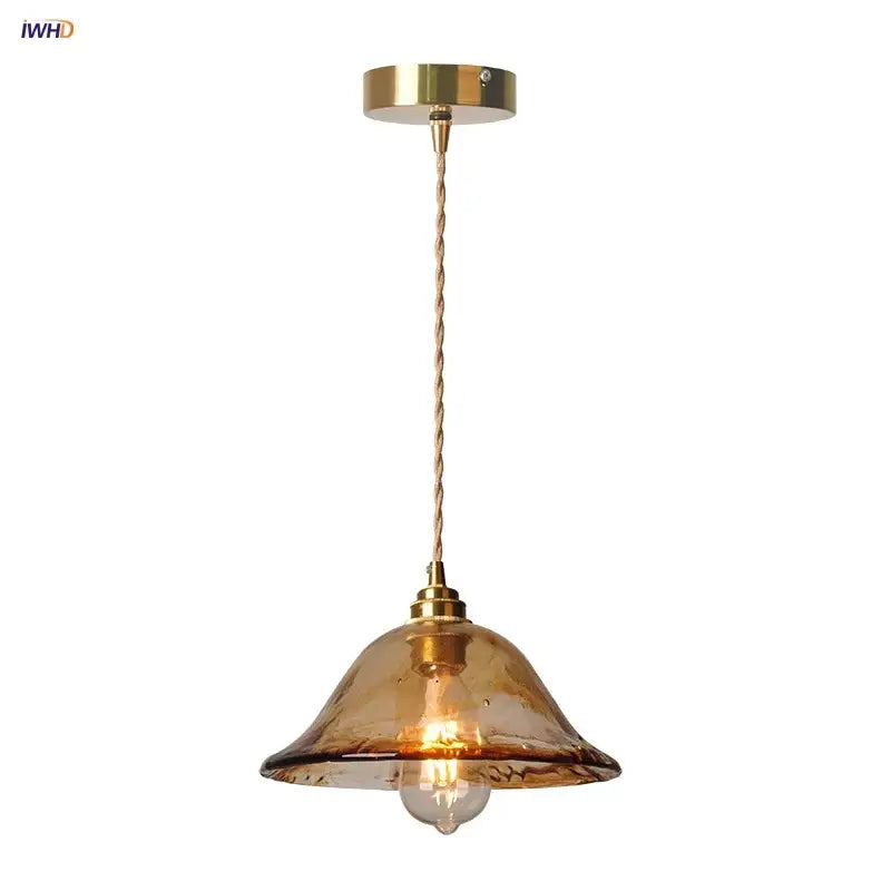 Vintage amber glass adjustable pendant light with brass finish and twisted cord for dining room lighting