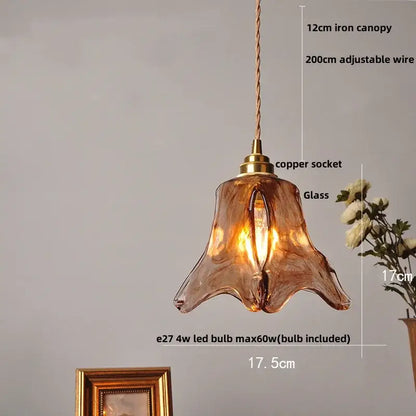 Vintage amber glass adjustable pendant light with copper socket and iron canopy featuring hand-blown design for dining room