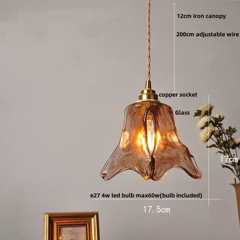 Vintage amber glass adjustable pendant light with copper socket and iron canopy featuring hand-blown design for dining room