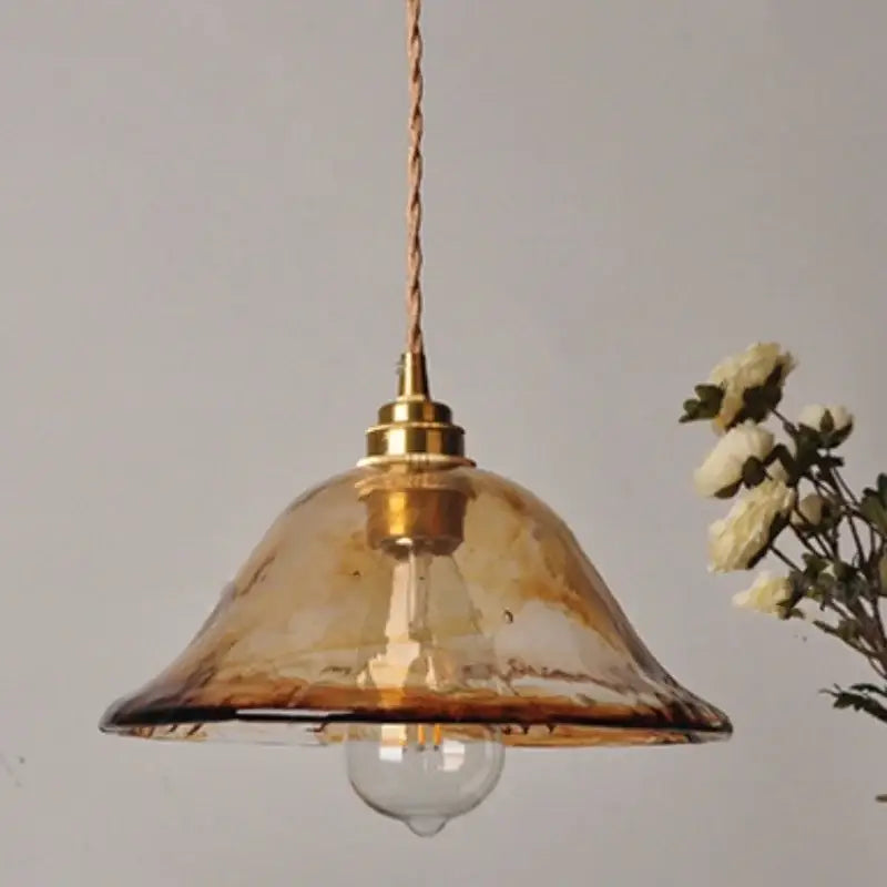 Vintage amber glass adjustable pendant light with warm amber glass and brass fixture for dining room lighting