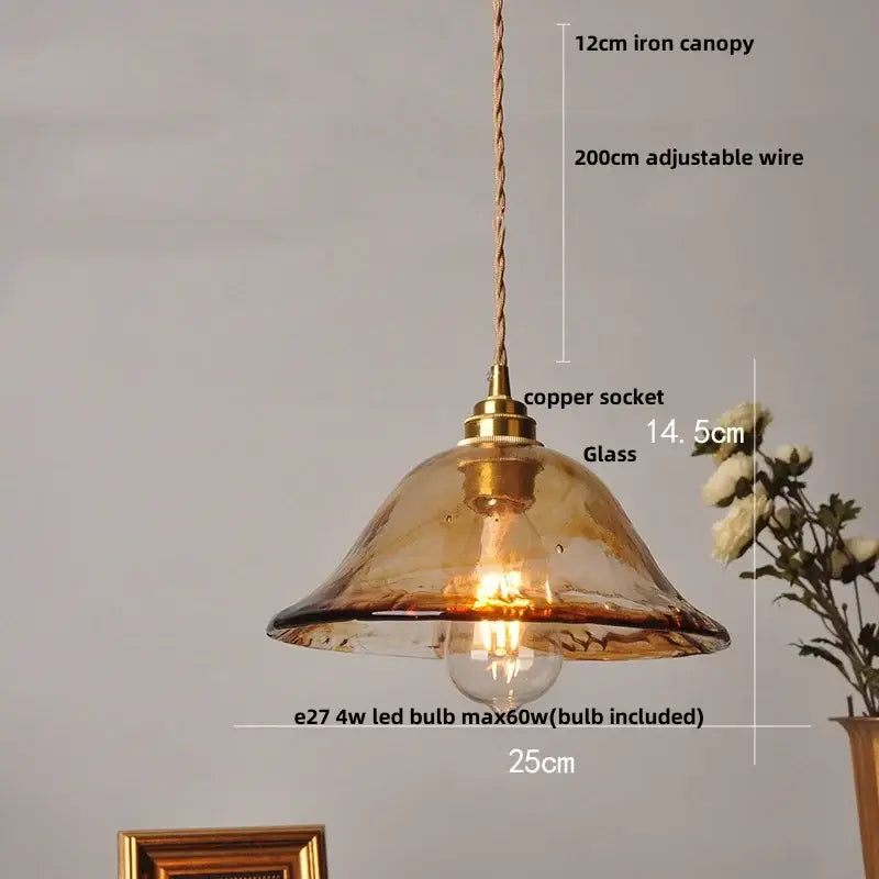 Vintage amber glass adjustable pendant light with warm amber-tinted glass and brass-finished copper socket for dining room