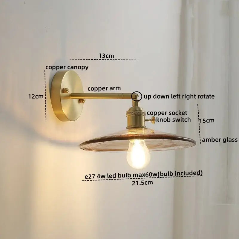 Brass-finished wall lamp with rotating copper arm, amber glass shade, and included e27 glass copper led bulb for bedroom