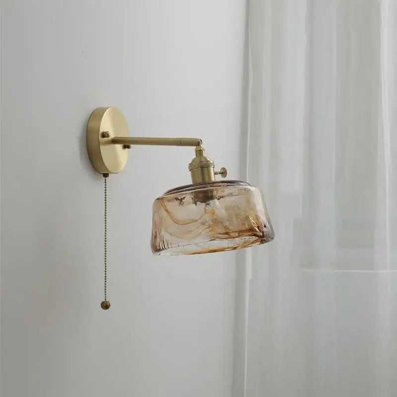 Vintage amber glass copper led wall lamp with brass arm and pull chain ideal for bedroom lighting