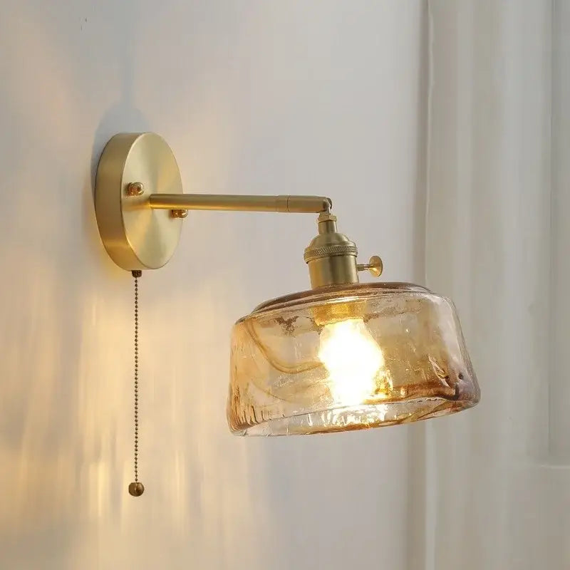 Brass-finished vintage amber glass copper led wall lamp with textured shade and adjustable arm for bedroom use