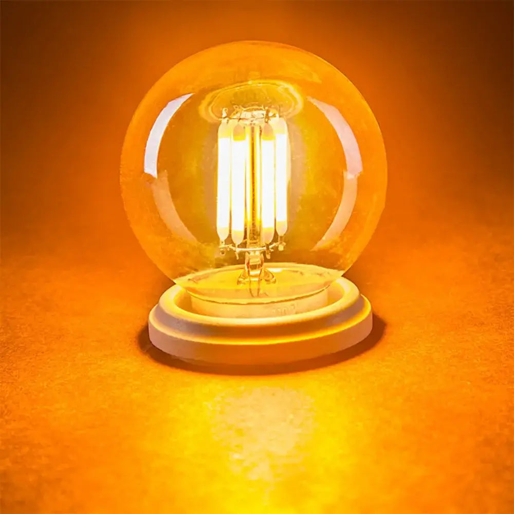 Vintage amber glass g40 3w led bulb with warm-toned filament emitting soft golden light for decorbites g40 led bulbs