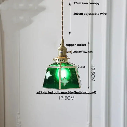 Vintage amber glass led pendant light with green glass, brass accents, and twisted iron canopy for dining room