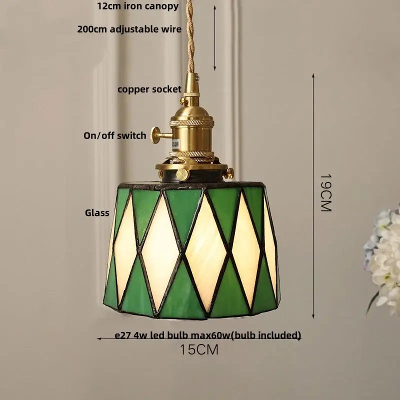 Vintage amber glass led pendant light with green and cream diamond-patterned stained glass and brass hardware