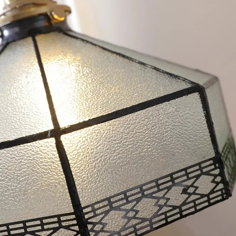 Vintage amber glass led pendant light with textured frosted panels and black leaded geometric accents for dining room