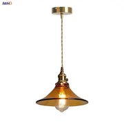 Vintage amber glass led pendant light with warm brass fixture and twisted copper wire suspension for kitchen decorbites amber glass