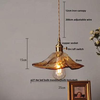 Vintage amber glass led pendant light with warm amber glass shade, brass copper socket, and twisted iron canopy decorbites amber glass