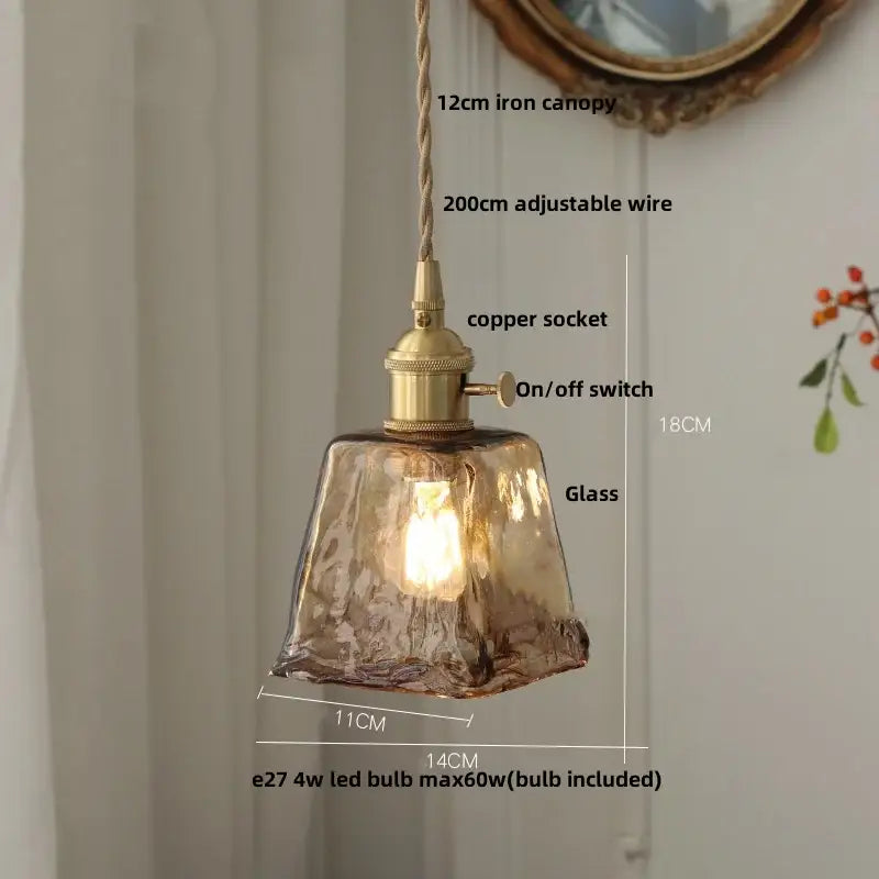 Vintage amber glass led pendant light with warm amber glass, brass-finished copper socket, and adjustable suspension by decorbites