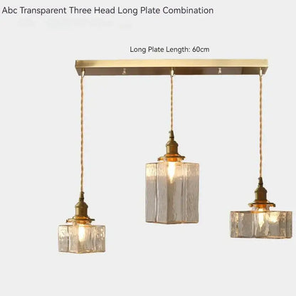 Vintage amber glass pendant light dining room fixture with gold-toned metal bar and textured glass pendant lights