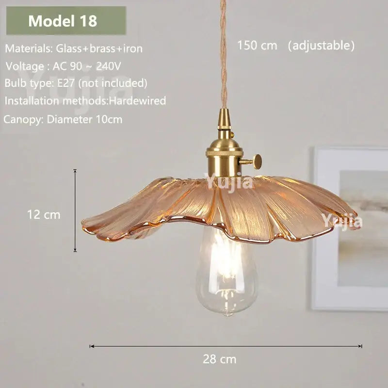 Vintage amber glass pendant light with brass fixture and adjustable cord for kitchen island lighting