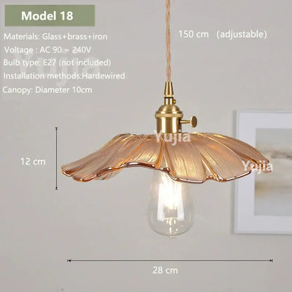 Vintage amber glass pendant light with brass fixture and adjustable cord for kitchen island lighting