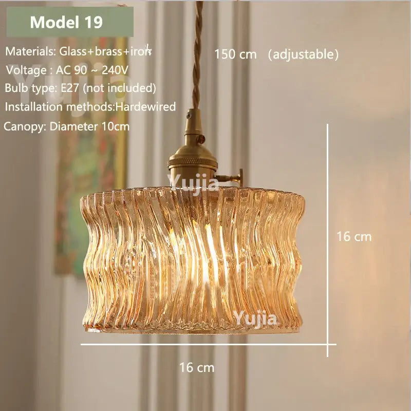 Model 19 is a warm-toned amber glass pendant light with wavy design and brass iron hardware for kitchen island lighting