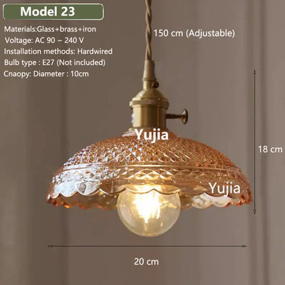 Vintage amber glass pendant light with brass fixture and diamond-cut textured shade for kitchen island lighting