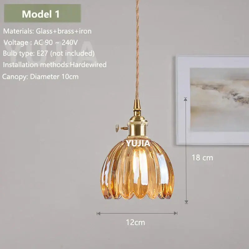 Vintage amber glass pendant light with brass fixture and twisted copper cord for kitchen island lighting